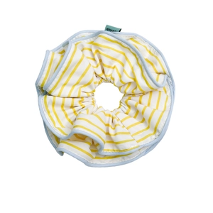 Striped yellow and blue fabric scrunchie with a handmade label and layered design
