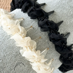 Ruched mesh headband with delicate beads in black and white for elegant hair styling