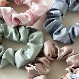 Silky satin scrunchies set with floral patterns and pastel colors for women