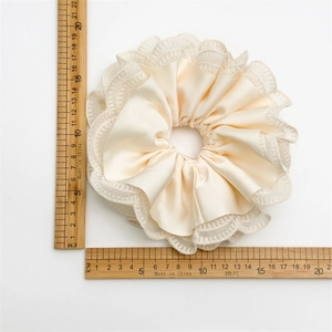 Elegant multi-layered lace and satin scrunchie in cream beige measuring about 15cm wide
