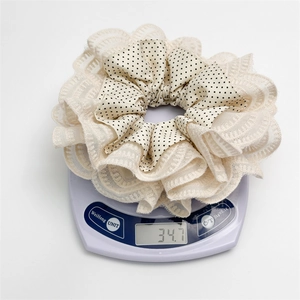 Detailed view of the oversized lace polka dot hair scrunchie weighing exactly 34.7g