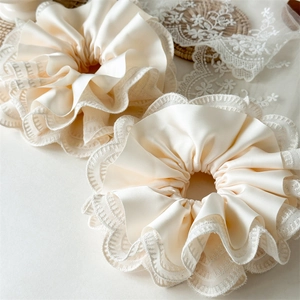 Set of two cream satin scrunchies with elegant lace trim in a vintage French style