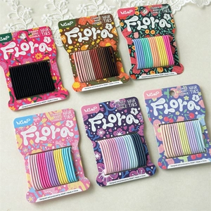 Assorted sets of thick seamless hair ties in six colorful pastel and neutral palettes