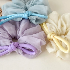 French vintage organza scrunchies with knotted ribbon in light blue, lilac, and beige colors