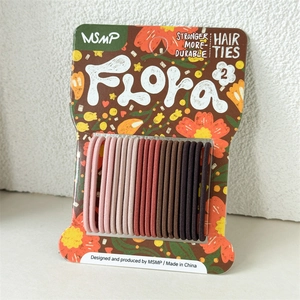 Detail of 20 seamless candy color hair ties on card display showing high elasticity