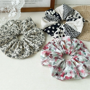 Three-piece floral scrunchie set featuring polka dot and watercolor prints for women