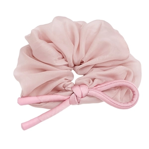 French vintage pink organza hair scrunchie with elegant bow detail on white background
