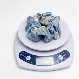 French style satin scrunchie with blue oil painting tie-dye pattern on weight scale