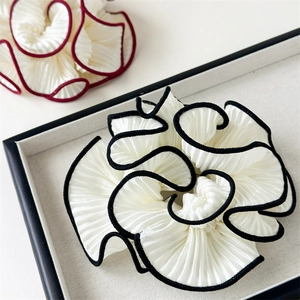 Elegant multi-layered pleated hair scrunchie with contrast wavy edges for high-end styling