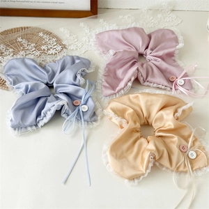 Elegant satin and lace scrunchie with button detail and ribbons in three colors