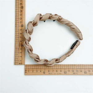 Champagne gold woven satin headband with high-top design and size scale measurements