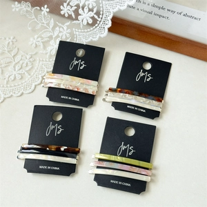 Three-piece acetate hair clip set featuring tortoiseshell and marble patterns for women