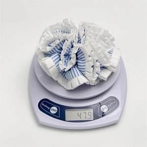 Blue and white striped layered scrunchie with lace trim shown on a digital scale