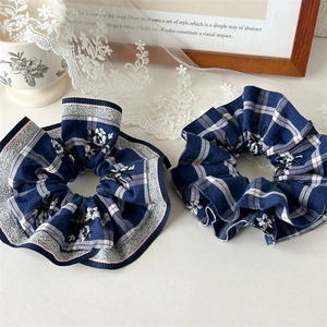 Set of 2 dark blue checkered scrunchies with lace edges and floral embroidery detail