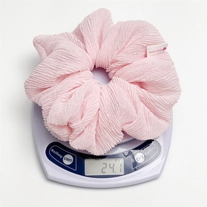 Pink oversized bubble scrunchie in textured fabric weighing 24g with heart tag