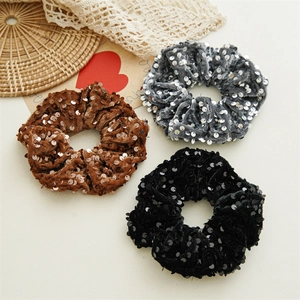 Sparkly sequin scrunchie set in black, brown, and silver grey for stylish hair styling