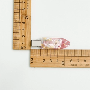 Detail shot showing 5.3cm colorful resin hair clip dimensions with measuring ruler
