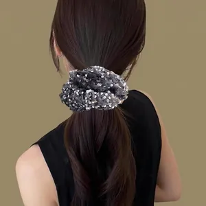 Chic black sequin oversized scrunchie for hair styling with sparkling silver accents
