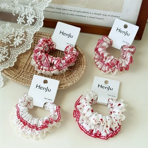 Set of 4 red polka dot and plaid scrunchies with white lace edges for hair styling