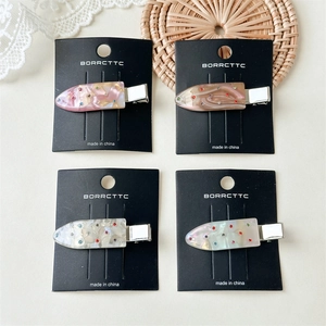 Set of four colorful rhinestone duckbill hair clips with elegant marble pattern texture