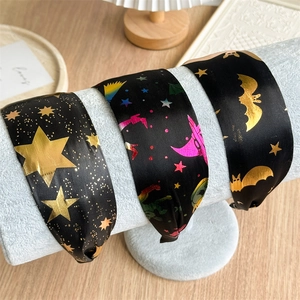 Black satin wide headband set with gold star and bat patterns for Halloween celebrations