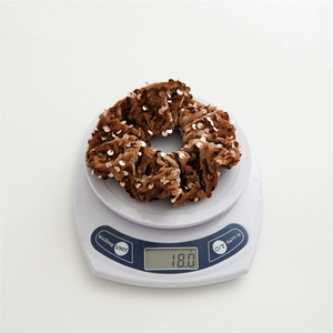 Detailed view of brown velvet hair scrunchie with sequins weighing 18.0 grams