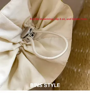 Detail view of the drawstring and spring buckle for easy adjustment on hair scrunchies