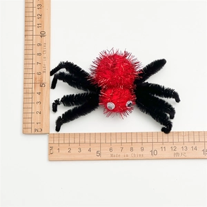 Pince à cheveux araignée d'Halloween avec pompons rouges pailletés et pattes noires
