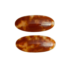 Pair of oval amber tortoiseshell acetate hair clips with gold France Handmade logo