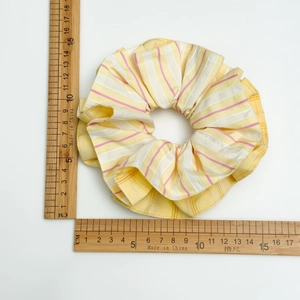 Detailed view of striped hair scrunchie size measurement showing 13.5cm diameter