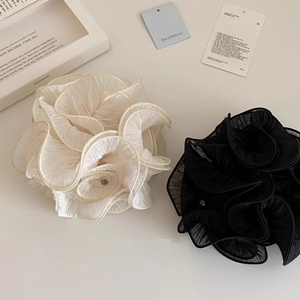 Romantic oversized mesh flower hair scrunchies in cream and black with a pleated design