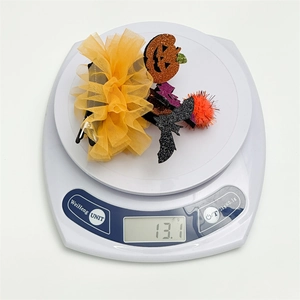 Halloween mesh bow hair clip with pumpkin and bat decorations weighed at 13.1 grams