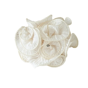 Elegant off-white ruffled fabric flower scrunchie with a central sparkling rhinestone
