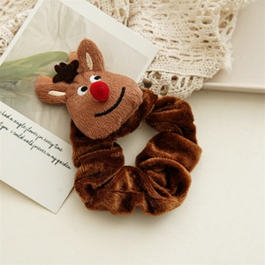 Close-up of brown plush Christmas scrunchie featuring a cute 3D reindeer doll with red nose