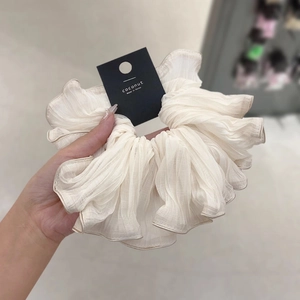 Elegant cream pleated scrunchie with brown edging and premium chiffon texture