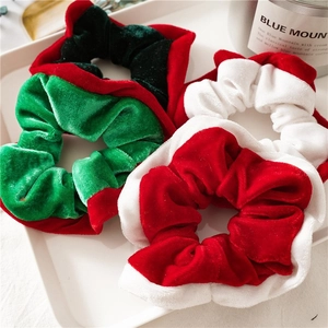 8-piece set of velvet Christmas scrunchies with festive red and green holiday patterns