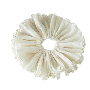 Elegant cream pleated scrunchie with ruffled edges made of lightweight translucent fabric