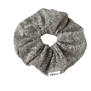 Elegant silver-grey mesh scrunchie with metallic sheen for high ponytail hairstyles
