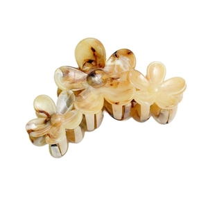 Elegant floral hair claw clip with amber marble texture for summer vacation styling