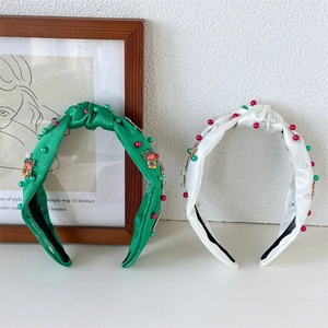 Christmas knotted satin headband set with festive pearl and bell accents in green and white