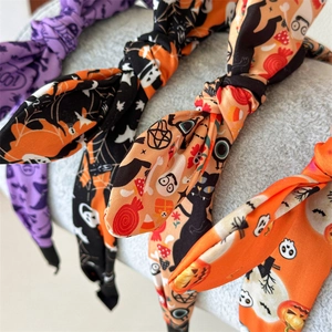 Halloween bunny ear headbands featuring festive ghost, bat, and pumpkin print patterns