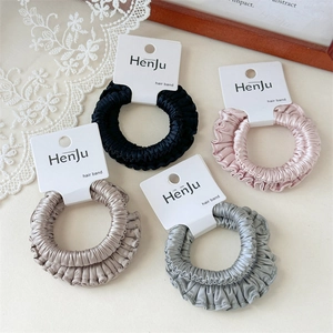 Set of 4 high-elastic satin scrunchies in black, pink, champagne, and grey-blue