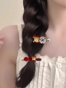 Close-up of sweet apple bead hair clips with pearls and Korean letter details