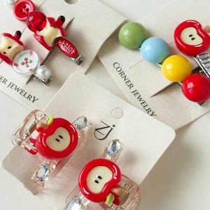 Cute apple and colorful beaded hair clips with rhinestones on a white display card