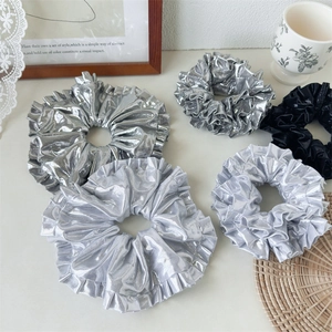Metallic pleated scrunchies set in silver and black with glossy laser texture