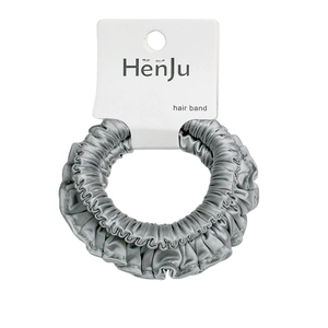 Silver satin scrunchie with pleated elastic design on white retail hanging card
