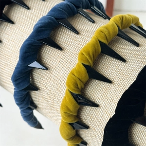 Detailed macro view of textured velvet headbands with secure toothed inner comb design