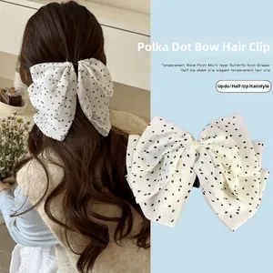 Pince à cheveux nœud à pois pour coiffure élégante avec couches de mousseline fine