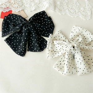 Barrettes à nœuds à pois élégantes en noir et blanc pour la coiffure des femmes