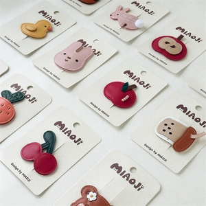 Detailed assortment of PU leather hair clips featuring cute cartoon animal and fruit designs